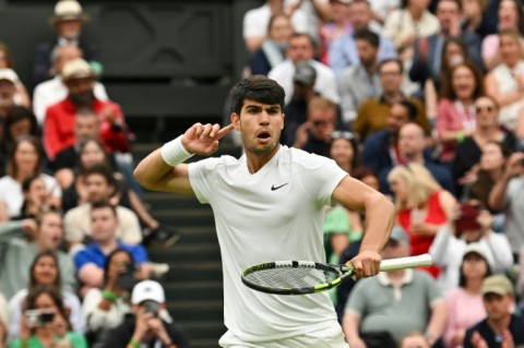 Football fan: Carlos Alcaraz faces Tommy Paul for a Wimbledon semi-final place