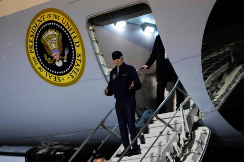 (FILES) US President Joe Biden steps off Air Force One upon arrival at Dover Air Force Base in Dover, Delaware, on July 17, 2024. Joe Biden holed up at his beach house July 18, 2024, battling both a bout of Covid and calls by senior allies for him to abandon his 2024 reelection bid.