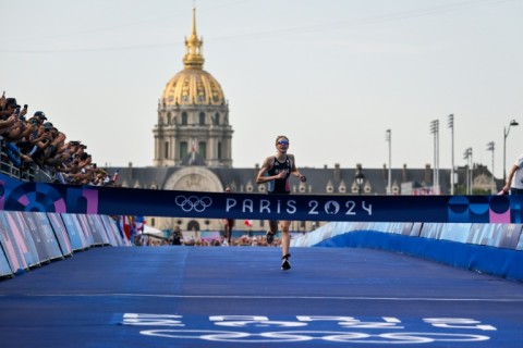France's Cassandre Beaugrand pulled away from the field to win the women's triathlon on home soil