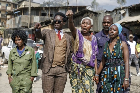 Activists Kasmuel McOure and Wanjira Wanjiru take their message to the Mathare slum