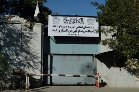 A sign of the Ministry for the Propagation of Virtue and the Prevention of Vice is seen at an entrance gate of a government building in Kabul 