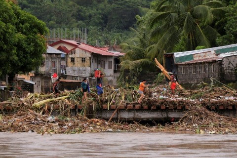Entire villages south of capital Manila have been submerged by Tropical Storm Trami