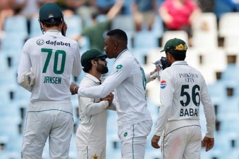 Pakistan's Mohammad Rizwan (CL) congratulates South Africa's Kagiso Rabada (CR) after he steered the hosts to victory in a nailbiting climax to the first Test