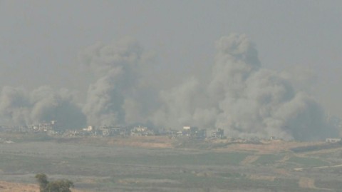 An Israeli army vehicle on a hill overlooking northern Gaza