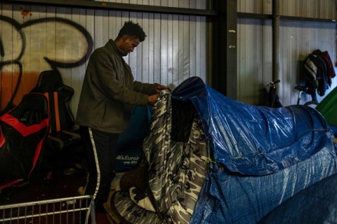 Hasan Abdullah, 21-year-old Sudanese migrant, said he wrapped himself in blankets and covered his tent with plastic to keep warm