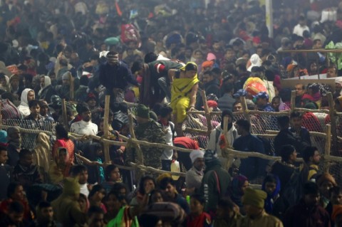 Devotees are seen at the site of a stampede at the  Kumbh Mela festival in Prayagraj