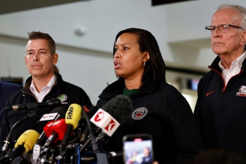 Officials including US Secretary of Transportation Sean Duffy (L) and Washington Mayor Muriel Bowser (C) address a media briefing at Reagan National Airport 