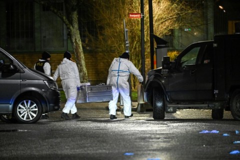 Forensic police at the Risbergska School in Orebro, Sweden, where a gunman killed 10 people and is believed to have shot himself