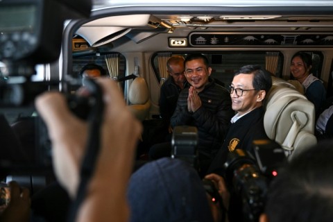 Freed Thai national Pongsak Thaenna leaves in a car after his return to Thailand with four others released after being held hostage in Gaza for more than a year