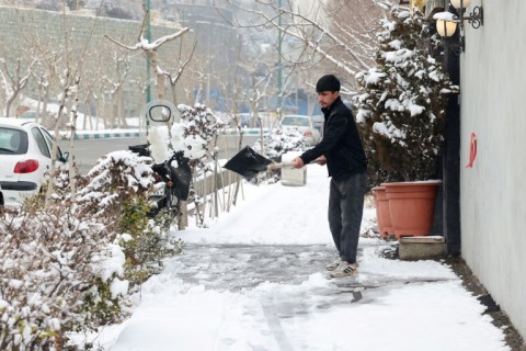 Clearing snow in the capital