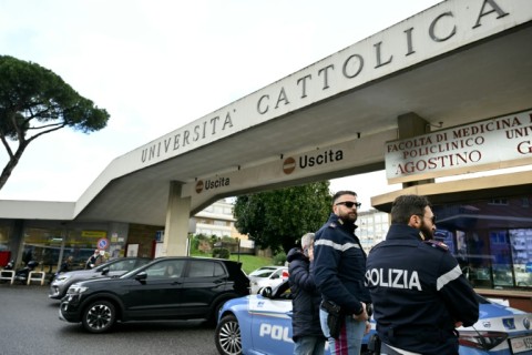 Police outside Rome's Gemelli hospital, where the pope was admitted for tests and treatment