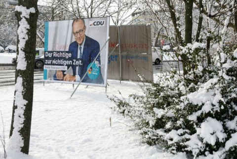 Election frontrunner Friedrich Merz seen on a campaign poster in Berlin on February 14, 2025