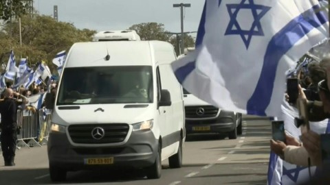 Convoy carrying dead Israeli hostages arrives at Tel Aviv forensic centre