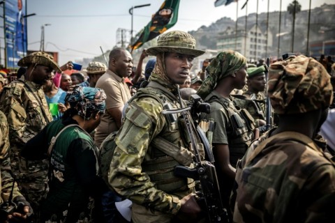 The Rwanda-backed group's fighters watched as the city's residents got to work