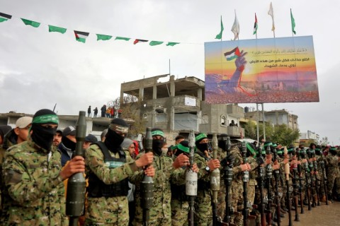 Hamas fighters gather in Rafah, southern Gaza, before militants freed two Israeli hostages