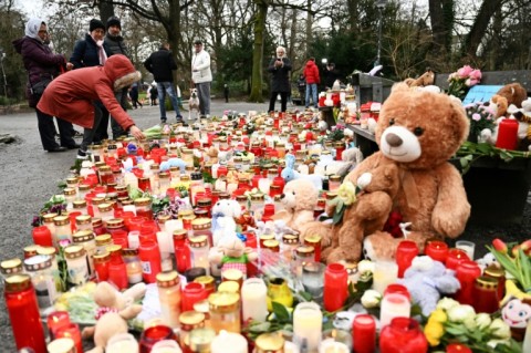 A memorial of candles, flowers and soft toys for the victims of a knife attack in Aschaffenburg where police arrested an Afghan man as the main suspect