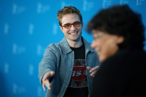 Robert Pattinson and South Korean director Bong Joon Ho pose during a photo call 
