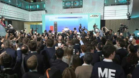 Supporters of Germany's conservatives cheer as exit polls predict win
