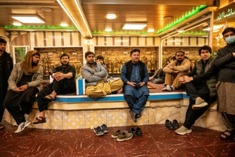 Afghan cricket fans watch the Champions Trophy match against England froma restaurant in Kabul