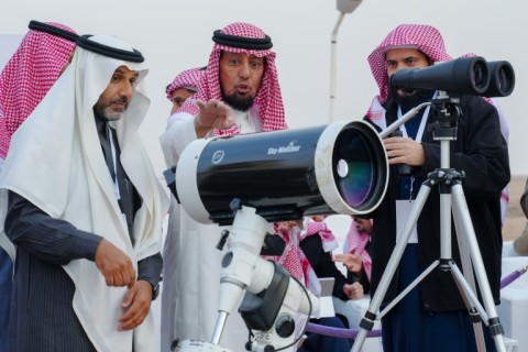 Abdullah al-Khudairi (C) takes his task so seriously that he stays away from smartphones and computer screens year-round, fearing they will dim his eyesight
