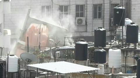 Israeli army excavator demolishes building in West Bank's Nur Shams