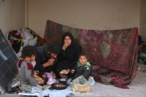 A displaced Palestinian family gathers for the iftar fast-breaking meal on the first day of Ramadan