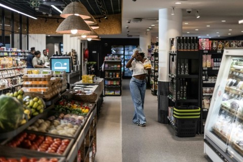 Inside the deli, sparkling wines, chocolates and flower bouquets share the shelves 