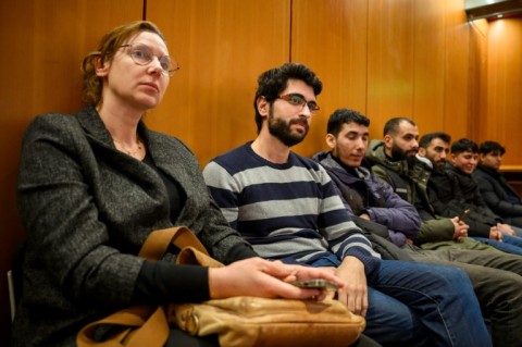 Asylum procedure consultant Britta Schmunz, on the left, with Bitar and other migrants