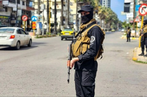 A picture released by the official Syrian Arab News Agency (SANA) shows Syrian forces in the coastal city of Tartus