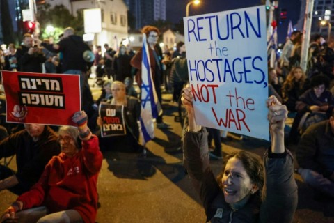 Family members and friends of Israeli hostages held in Gaza deamnd their government implement the ceasefire rather than restart the war 