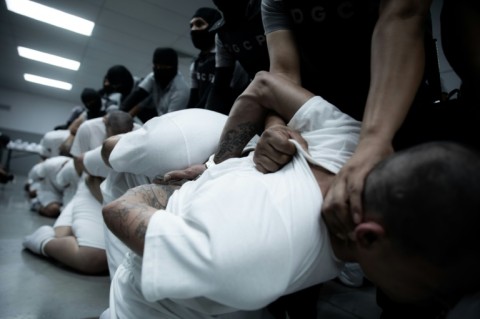 A handout picture released by El Salvador's Presidency press office shows the arrival of alleged members of the Venezuelan criminal organization Tren de Aragua