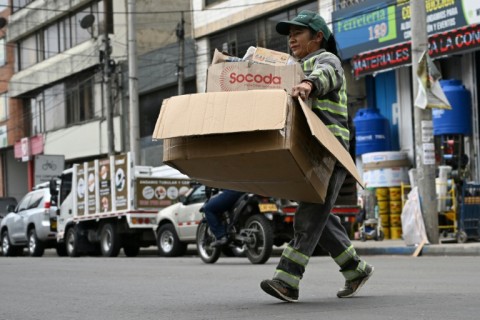 Recycler Mary Luz Torres collects recyclables in Bogota, a city of eight million people that produces 9,000 tons of waste each day