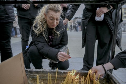 Mourners lit candles for the victims