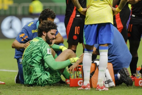 Liverpool's Alisson returns early from Brazil duty with suspected ...