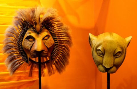 Foreign visitors often visit New York's Broadway theater district to see shows such as 'The Lion King' -- masks from the show are on display at the Museum of Broadway in Times Square