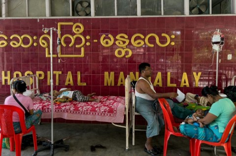 Mandalay General Hospital -- the city's main medical facility -- has around 1,000 beds but despite high heat and humidity, most patients are being treated outside