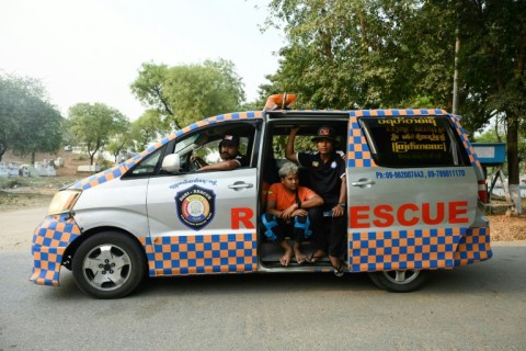 Rescue workers are seen in their vehicle after transporting the body of a victim for cremation near Mandalay, Myanmar