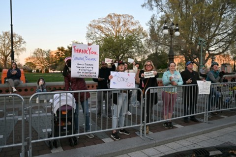 Some people gathered outside the Capitol building to support Booker