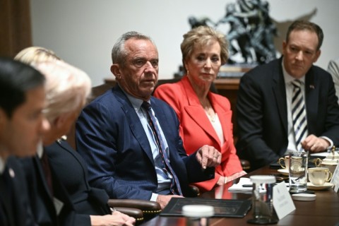 US Secretary of Health and Human Services Robert F. Kennedy Jr. (C) speaks as US President Donald Trump hosts (L) hosts a cabinet meeting in the Cabinet Room of the White House on March 24, 2025
