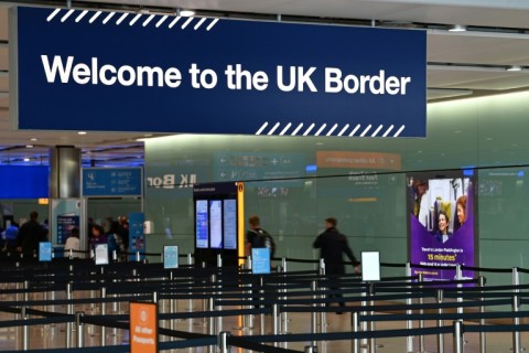 A large sign welcomes travellers arriving at passport control in Terminal 2 at London's Heathrow Airport