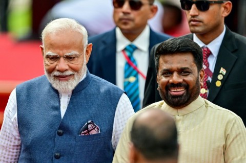 Sri Lankan President Anura Kumara Dissanayake (R) rolled out the red carpet for Indian leader Narendra Modi (L) and conferred on him the country's highest civilian honour