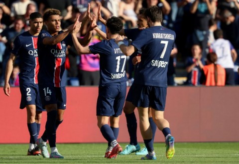 Desire Doue celebrates with teammates after scoring PSG's winning goal against Angers