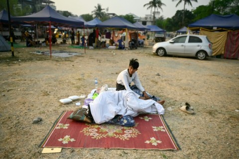 Reluctant to spend time in cracked and unstable structures, many Mandalay residents have been sleeping outside in tents