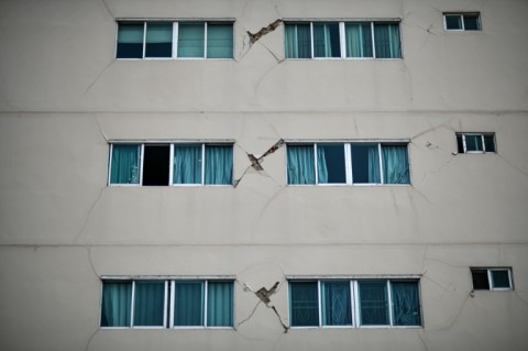 Cracks show on the exterior of a residential condominium building in Bangkok after the March 28 earthquake