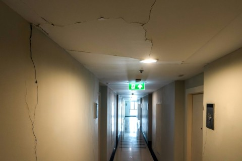 A damaged corridor inside a high-rise residential condominium in Bangkok