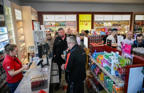 Romanian tourists line up to shop for goods at a supermarket in Rousse