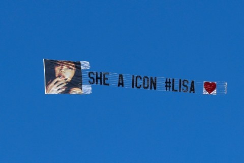 A banner featuring an image of Thai singer and actress Lisa is flown above the 2025 Coachella Valley Music and Arts Festival at Empire Polo Club on April 11, 2025 in Indio, California