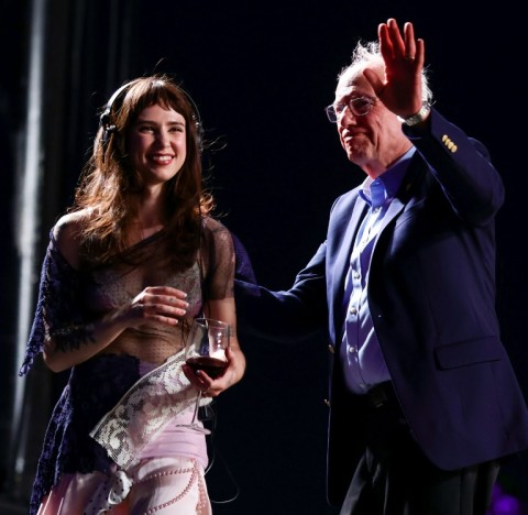 Singer Clairo (L) and US Senator Bernie Sanders (R) onstage at the Coachella music festival