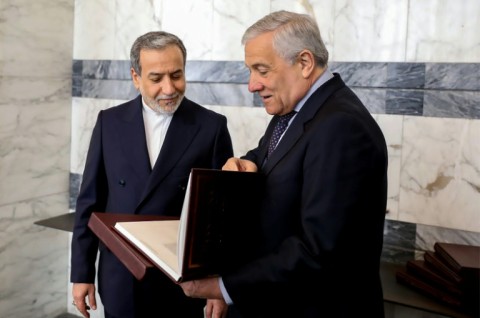 This handout picture shows Iran's Foreign Minister Abbas Araghchi (L) meeting Italy's Antonio Tajani in Rome