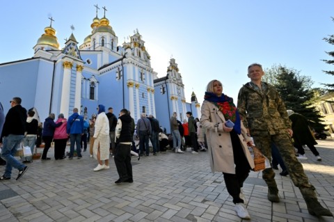 Outside St Michael's Golden-Domed Monastery in central Kyiv, Orthodox believers had come to worship on a bright sunny morning